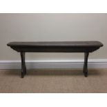 An antique oak gothic style Bench with solid seat on pierced trestle supports, 3ft 10in