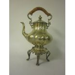 A large Victorian plated Tea Kettle with engraved decoration, cane covered handle on Stand with