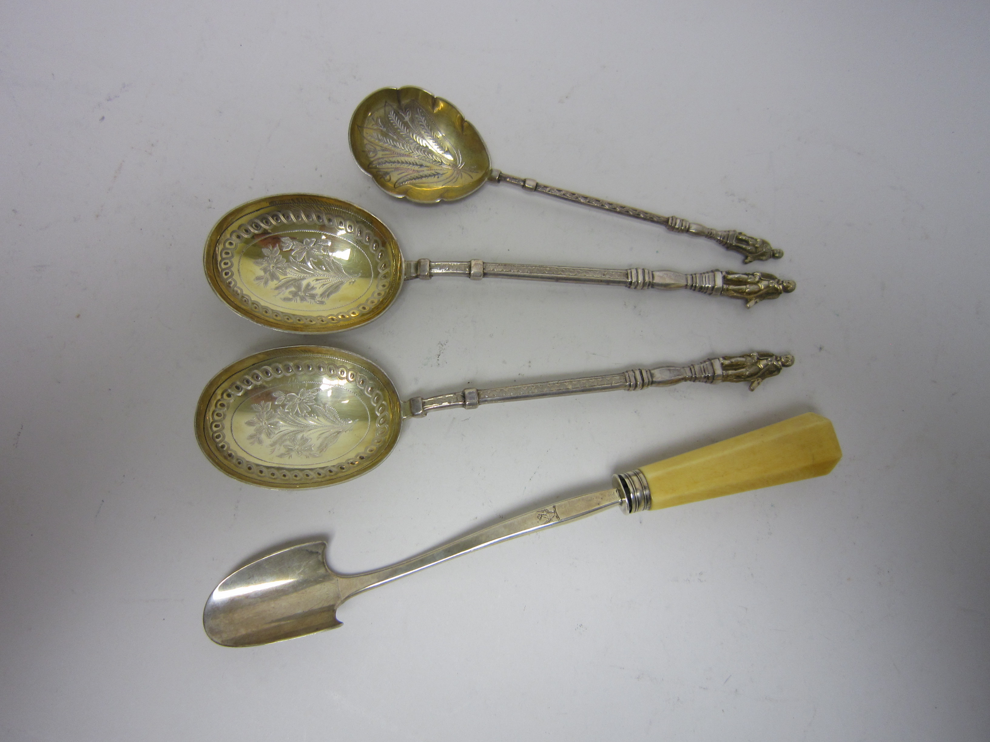 A George III silver Stilton Scoop, London 1811 and a pair of parcel gilt Serving Spoons and matching