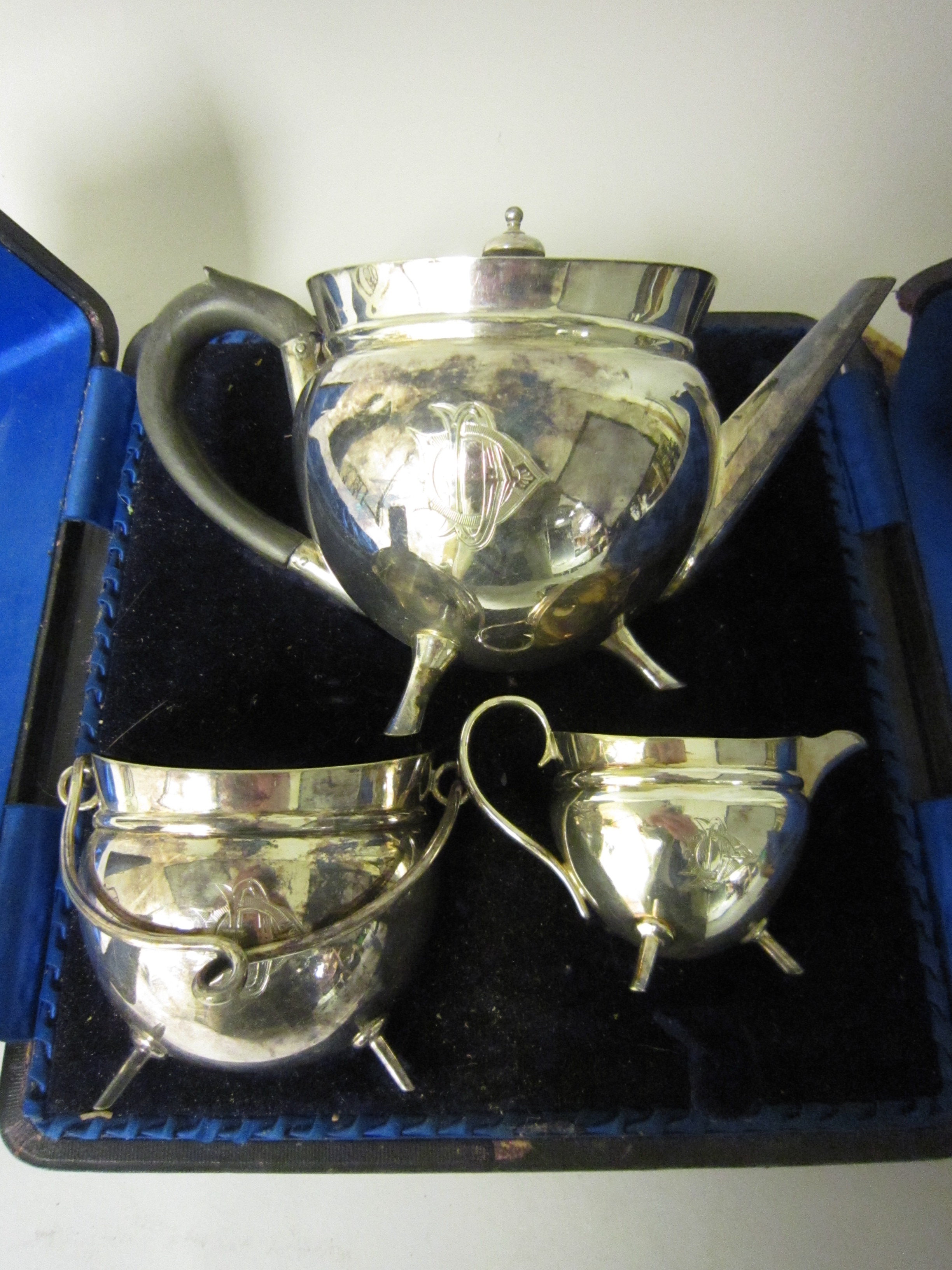 An Aesthetic Movement plated three piece Tea Service, engraved initials on peg feet, in case - Image 2 of 2