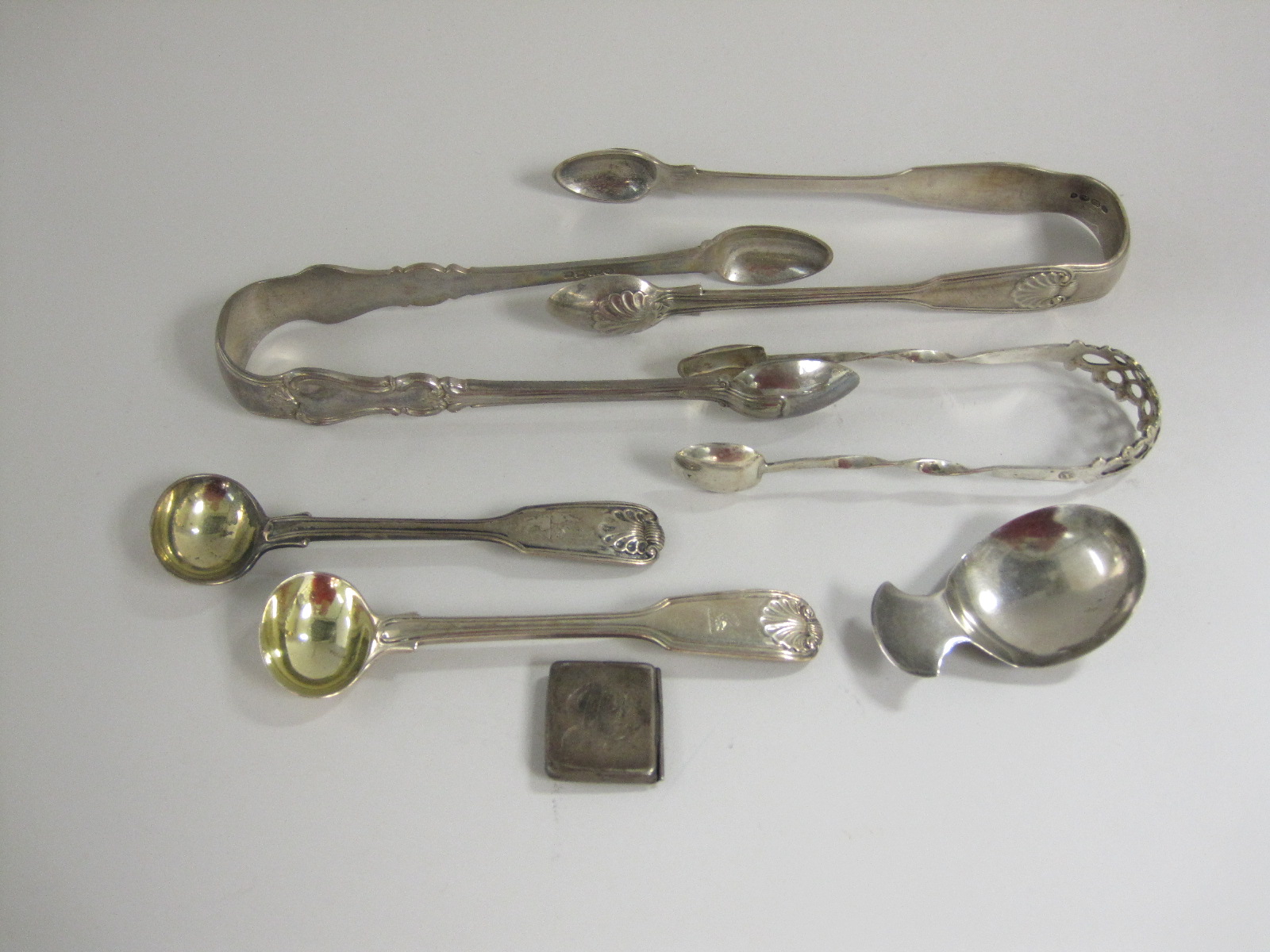 A George III silver plain Caddy Spoon, London 1810, maker: J.S, two William IV silver Salt Spoons