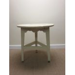 An antique white painted circular Cricket Table, 2ft 4in