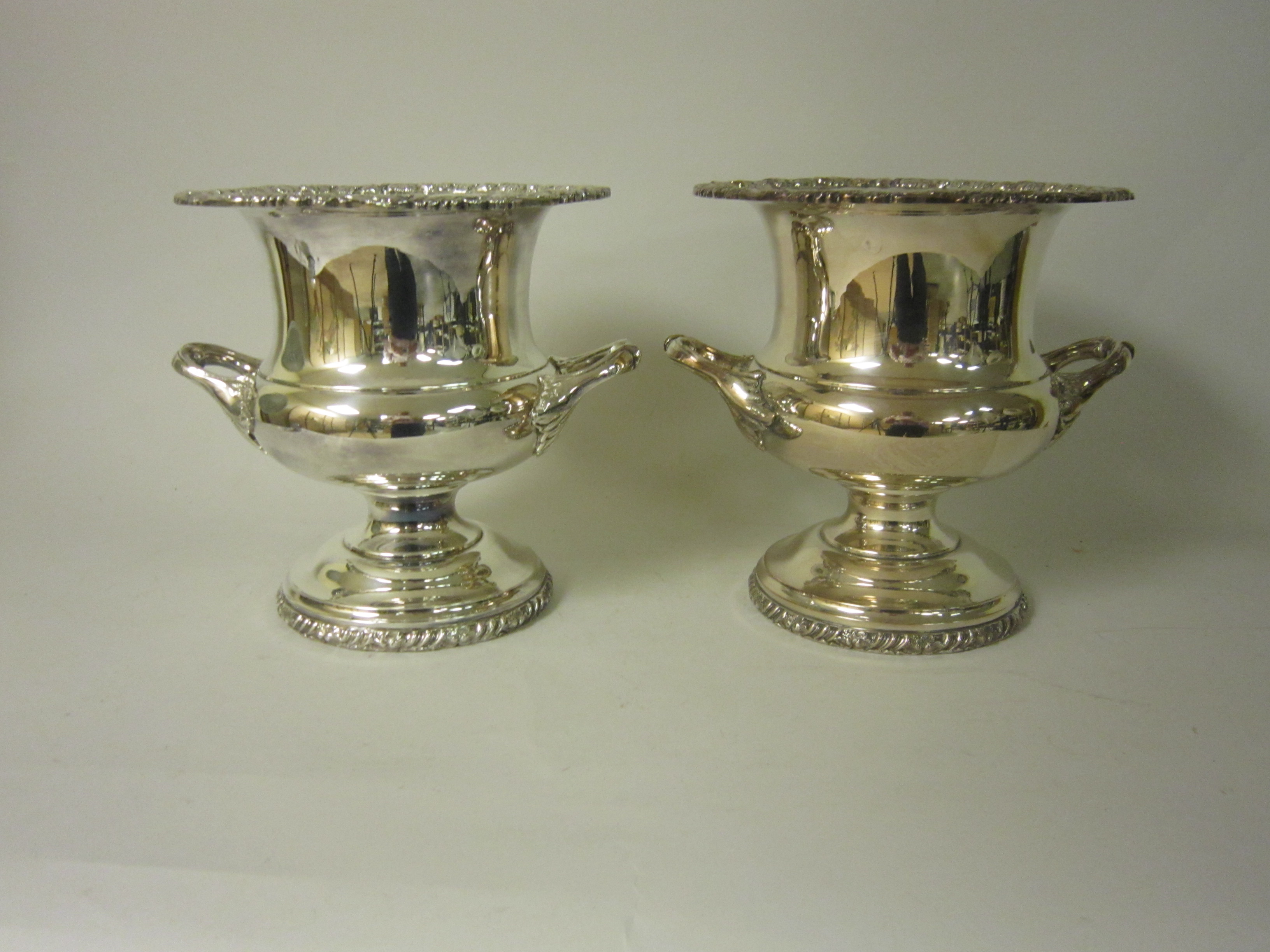 Pair of plated two handled Wine Coolers with foliate and scroll rims, 10in