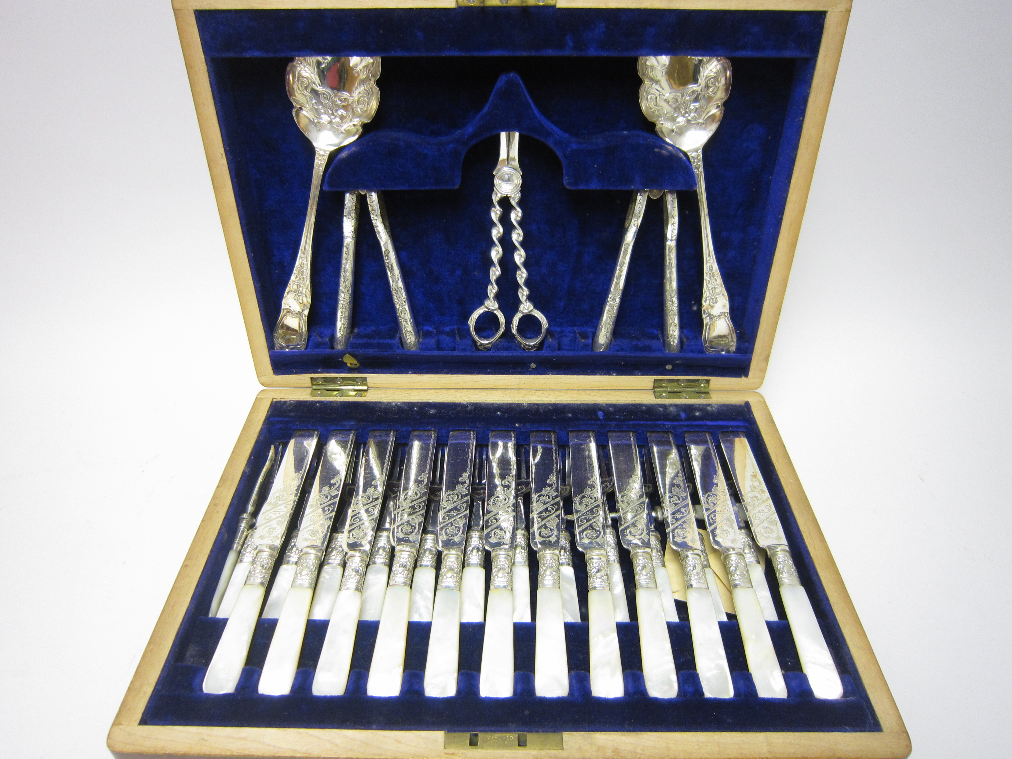 One dozen Victorian plated Dessert Knives and Forks with mother of pearl hafts, plus Grape Scissors,