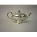 A Victorian silver Teapot of compressed circular form with chinoiserie engraving and vacant