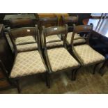 A set of six Regency mahogany Dining Chairs with rope twist backs, drop in seats on sabre supports