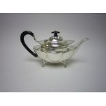 An Edward VII silver Teapot of shaped oval form with ebonised scroll handle, Birmingham 1907