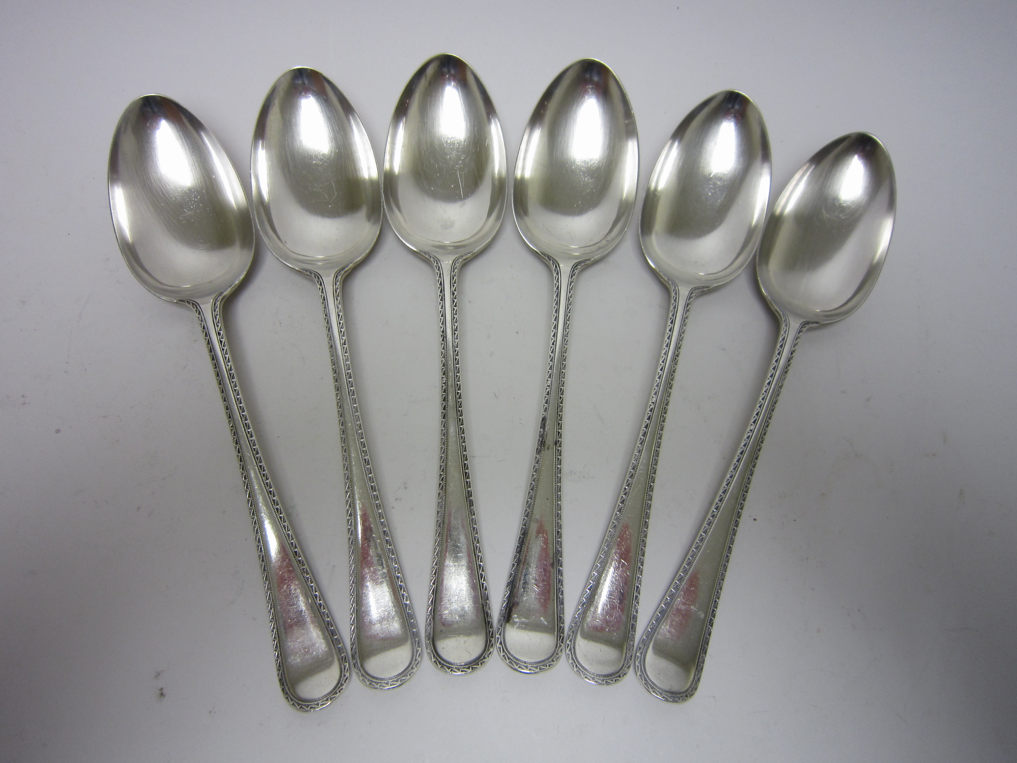Six Victorian silver Table Spoons with feather edge stems, Birmingham 1883, maker: F Elkington