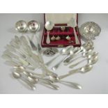 A Continental silver Tea Strainer decorated cherubs, quantity of silver Butter Knives, Jam and