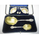 Two Victorian silver-gilt Strawberry Spoons with gilt swags, import mark London 1899, and a pair