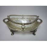 An EP mounted cut glass oval Fruit Bowl on stand with floral engraved frieze, leafage scroll