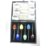 Six George VI silver and coloured enamel Coffee Spoons with bead stems, Birmingham 1951, in case and