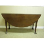 A 19th Century mahogany Gate-leg Dining Table on turned tapering supports and pad feet, 4ft 8in W