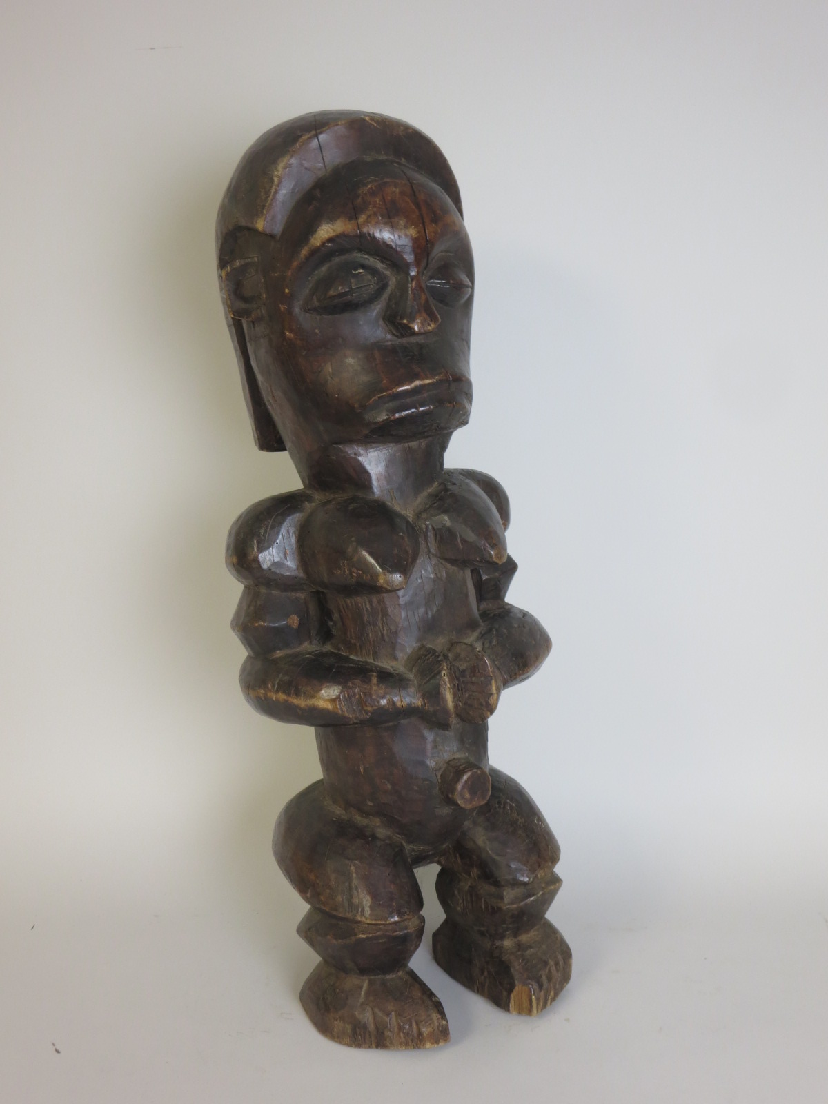A carved African Figure of a seated female, 26in H