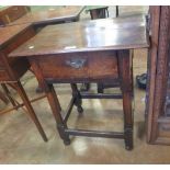 An 18th Century oak Side Table the moulded overhanging top above a frieze drawer, raised on turned