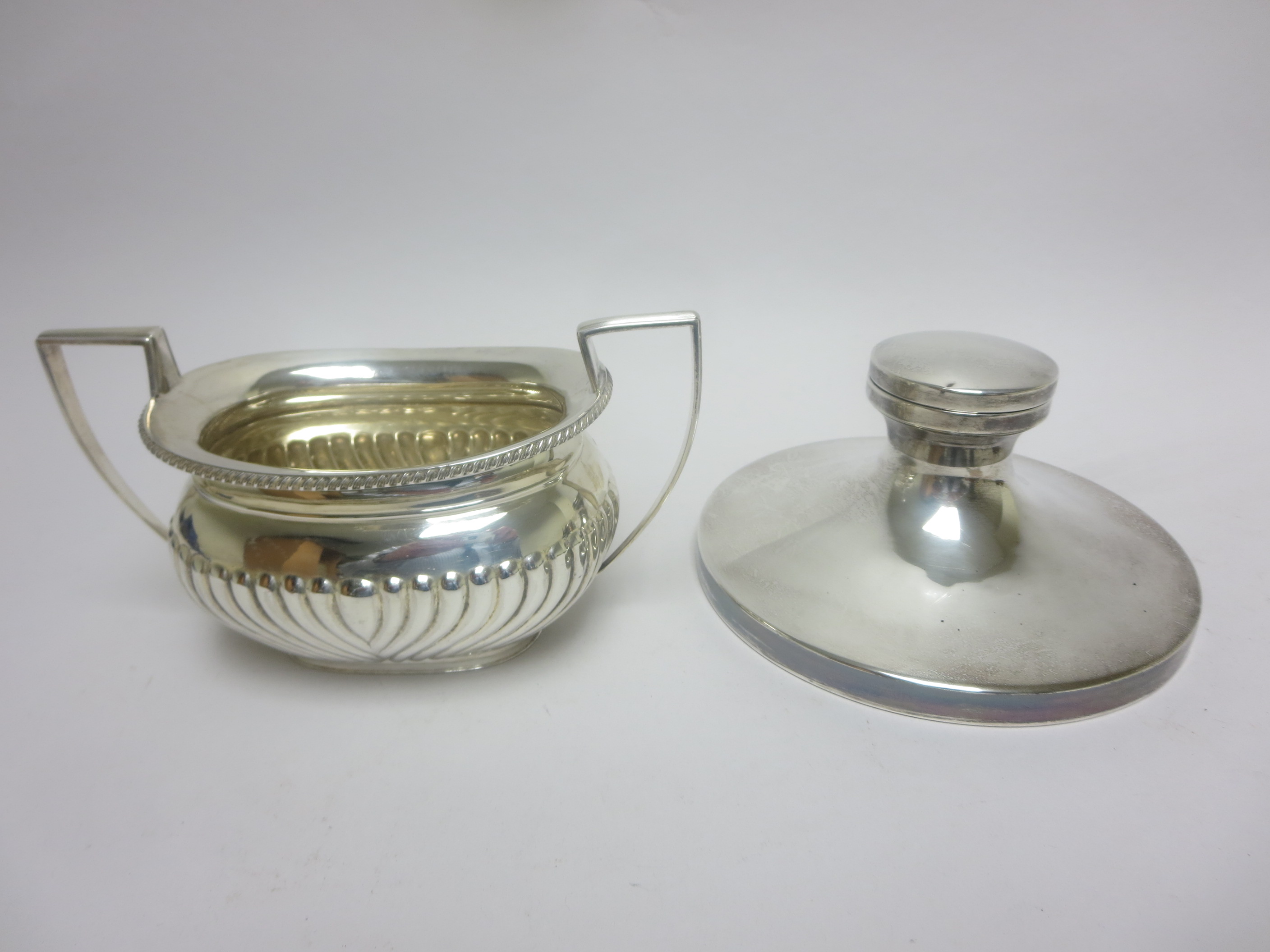 A George V silver two handled boat shape Sugar Bowl with gadroon embossing, Sheffield 1914, and a