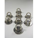 Eight silver Menu Holders in the form of horse shoes on circular bases, stamped Birmingham T&S