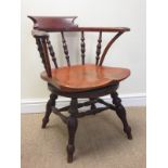 An antique elm revolving Captain’s Chair with turned spindle back on four turned legs
