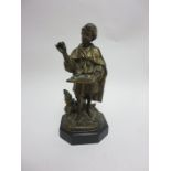 A gilded bronze Figure of Trader selling tobacco, standing besides tobacco plant, on octagonal slate