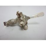 A Victorian silver Rattle with six applied bells, floral embossed, mother of pearl teether, maker: