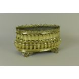 An ornate French brass Jardiniere of oval form with pierced scrolled rim above embossed repeating