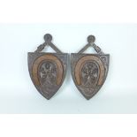 Two carved oak Shields with horseshoe and acorn designs, 14in