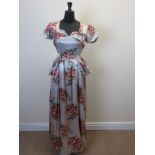 A 1940’s Evening Dress in oyster satin with large flowers and a 30’s printed long Coat