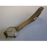 A Lady’s Rotary Wristwatch the champagne dial with arabic numerals and chevron markers on 9ct gold