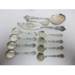 A late 19th Century French silver pair of Ice Cream Servers and nine Spoons with floral and scroll