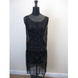 A French black chiffon beaded flapper dress labelled Made in France. Size 44