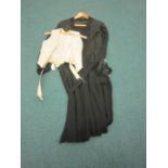 A cream brocade lined Bodice labelled Madame Howes Birmingham and a black 1930’s Dress with a