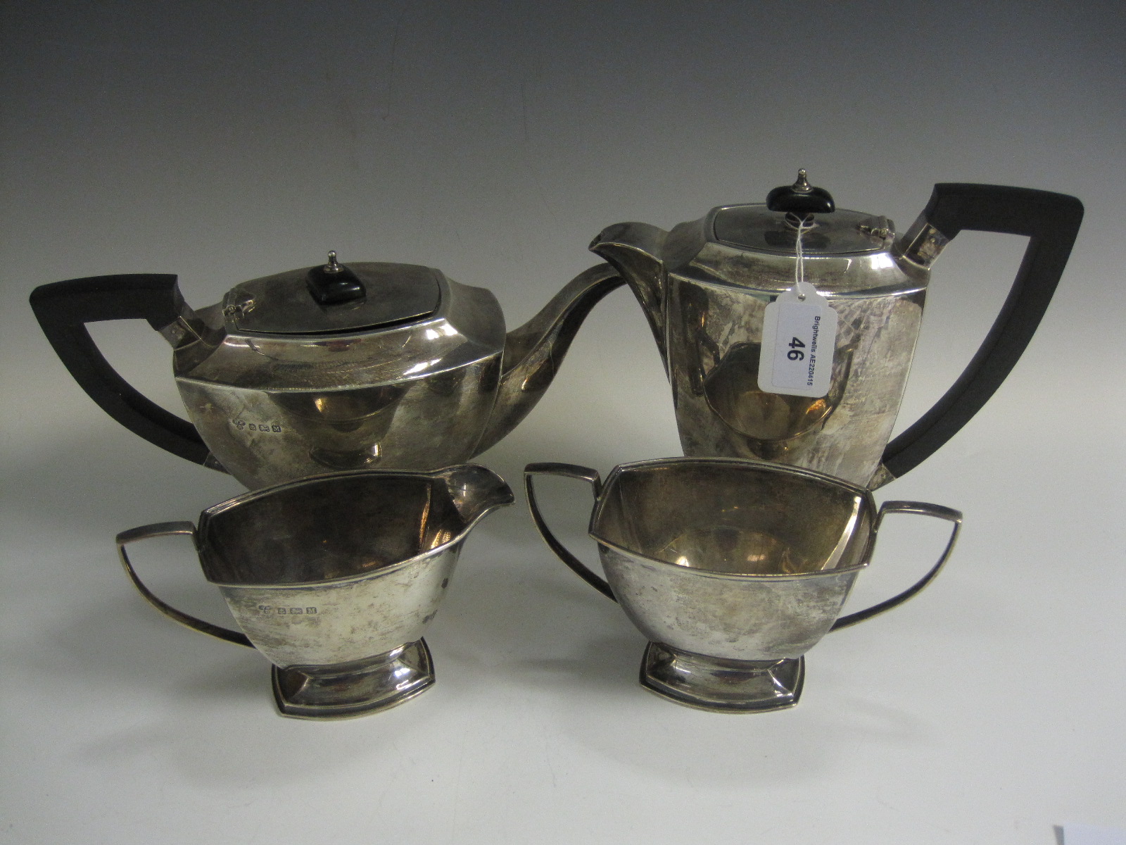 An Edward VIII silver four piece Tea Service with ebonised handles, Birmingham 1936