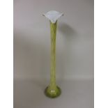 A tall slender yellow glass Lily Vase with spreading base, 31in H