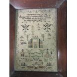 A silk on linen cross stitch Sampler with verse, house and figures worked in greens and browns by