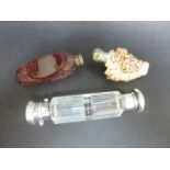 A silver lidded double-ended clear glass Scent Bottle, a shell Scent Bottle and a Bohemian glass