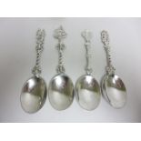 Four George V silver Serving Spoons with ornate figural stems, London 1929