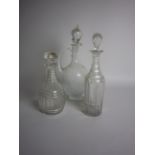 Two cut glass Decanters and Stoppers and a Carafe with loop handle and stopper