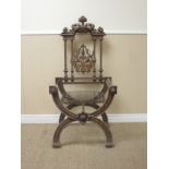 A cast iron Chair with pierced back and mesh seat on a cross frame