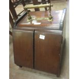 A Victorian mahogany Coal Box the brass handle operating to open the two front doors