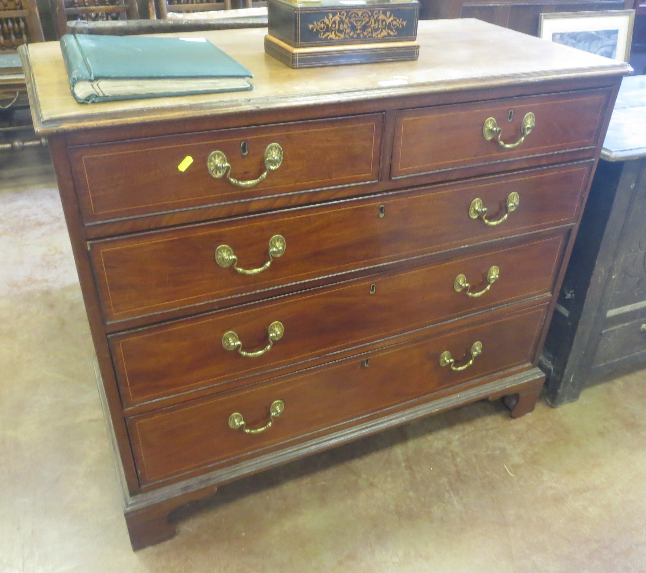 A Victorian mahogany Chest of two short and three long graduated drawers with satinwood stringing on