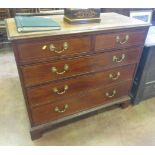 A Victorian mahogany Chest of two short and three long graduated drawers with satinwood stringing on