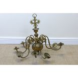 A brass eight branch Chandelier with double phoenix surmount