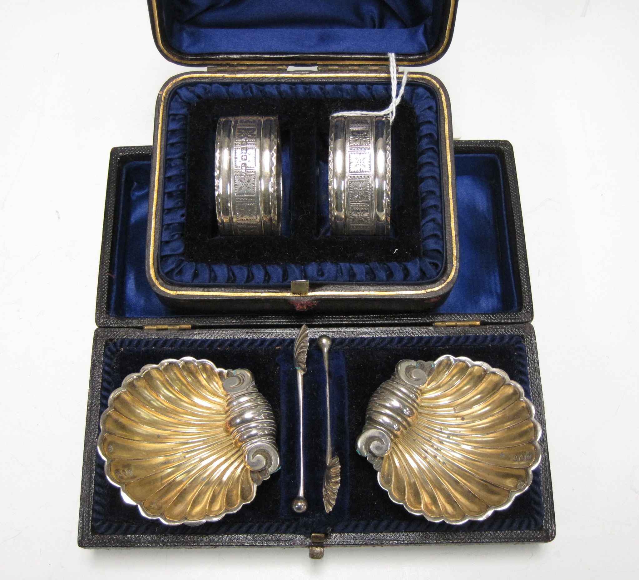 A pair of Victorian silver Shell Salts with matching spoons, London 1894, cased, and a matched