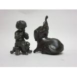 A Japanese bronze seated Elephant, 4in, and a metal Pepperette in the form of Pan, 3in