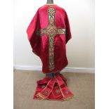 A rich crimson satin Chasuble with metallic gold braid. Hand embroidered orphrey with stylised