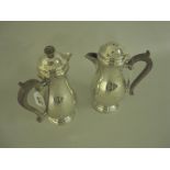 Pair of George VI silver baluster Hot Water Jugs with scroll handles, London 1937/8