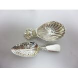 A George IV silver Caddy Spoon fiddle pattern with leaf bowl, London 1824, and another with shell