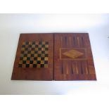 A mahogany folding Games Board with brass hinges and inlaid satin walnut and rosewood playing