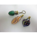 A green cut glass small torpedo shape Scent Bottle and two Venetian multi-coloured glass Scent