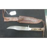 An antler handled original Puma-Bowie Knife in leather Scabbard